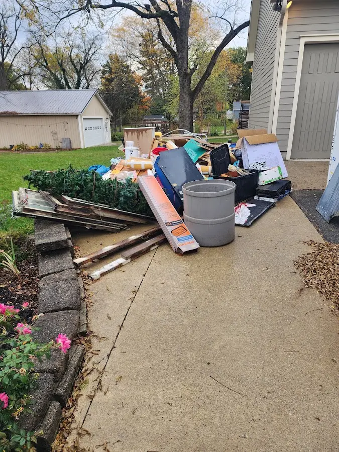 Dumpster being loaded with debris for 3 Yard Dumpster Rental in North Fort Lewis